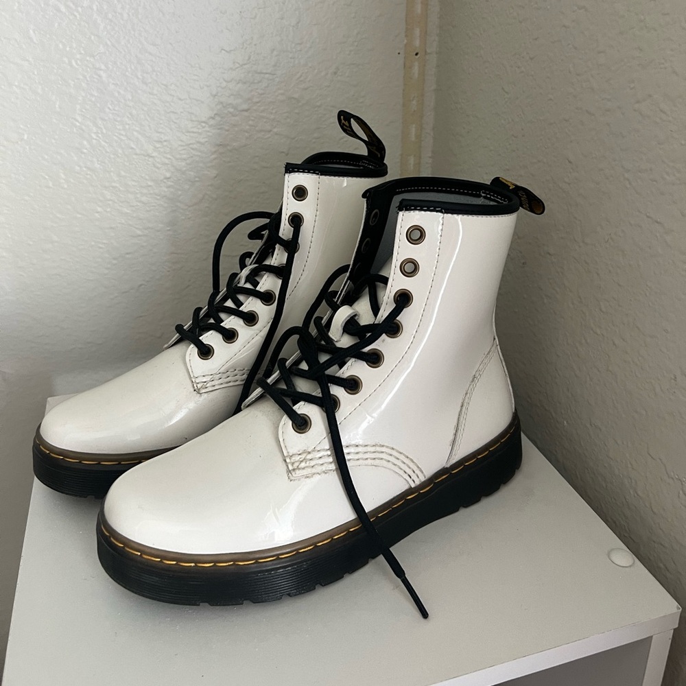 Woman’s white doc martens
